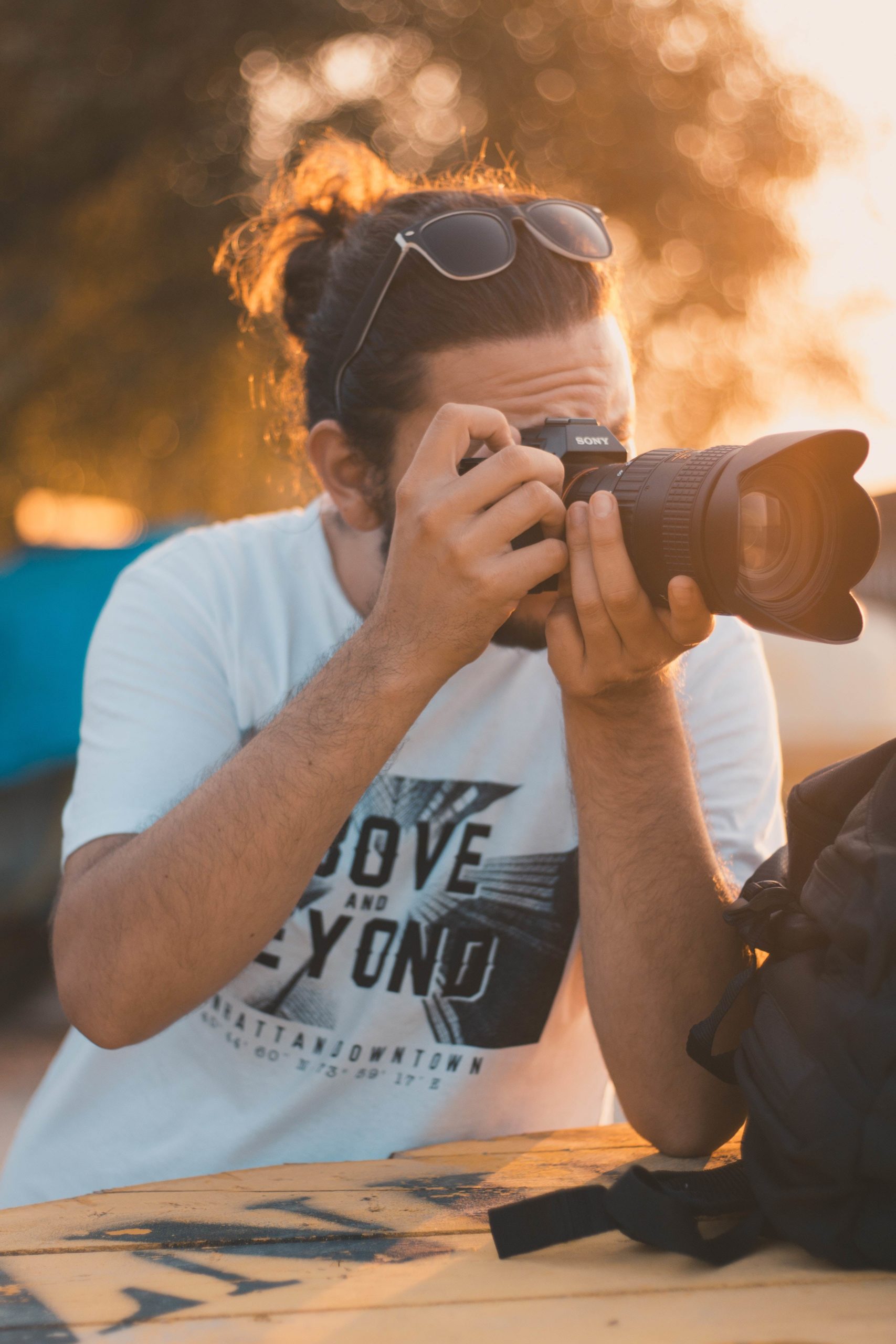 photo-of-man-taking-photo-with-dslr-camera-1996759